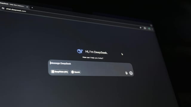 A dark-themed chat interface displaying an AI assistant conversation starter on a screen.
