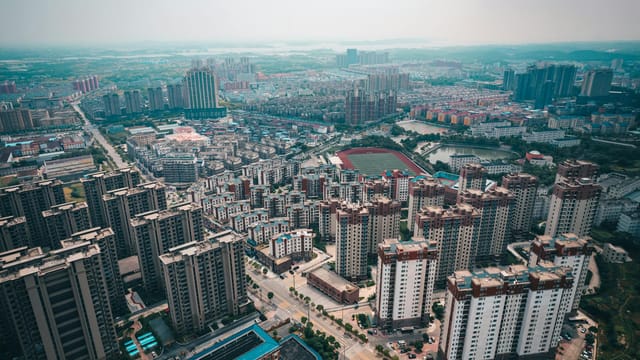 Drone shot showcasing the urban landscape of Jiujiang, Jiangxi, China from above.