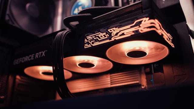 Detailed image of a GeForce RTX GPU with glowing LED lights inside a computer case.