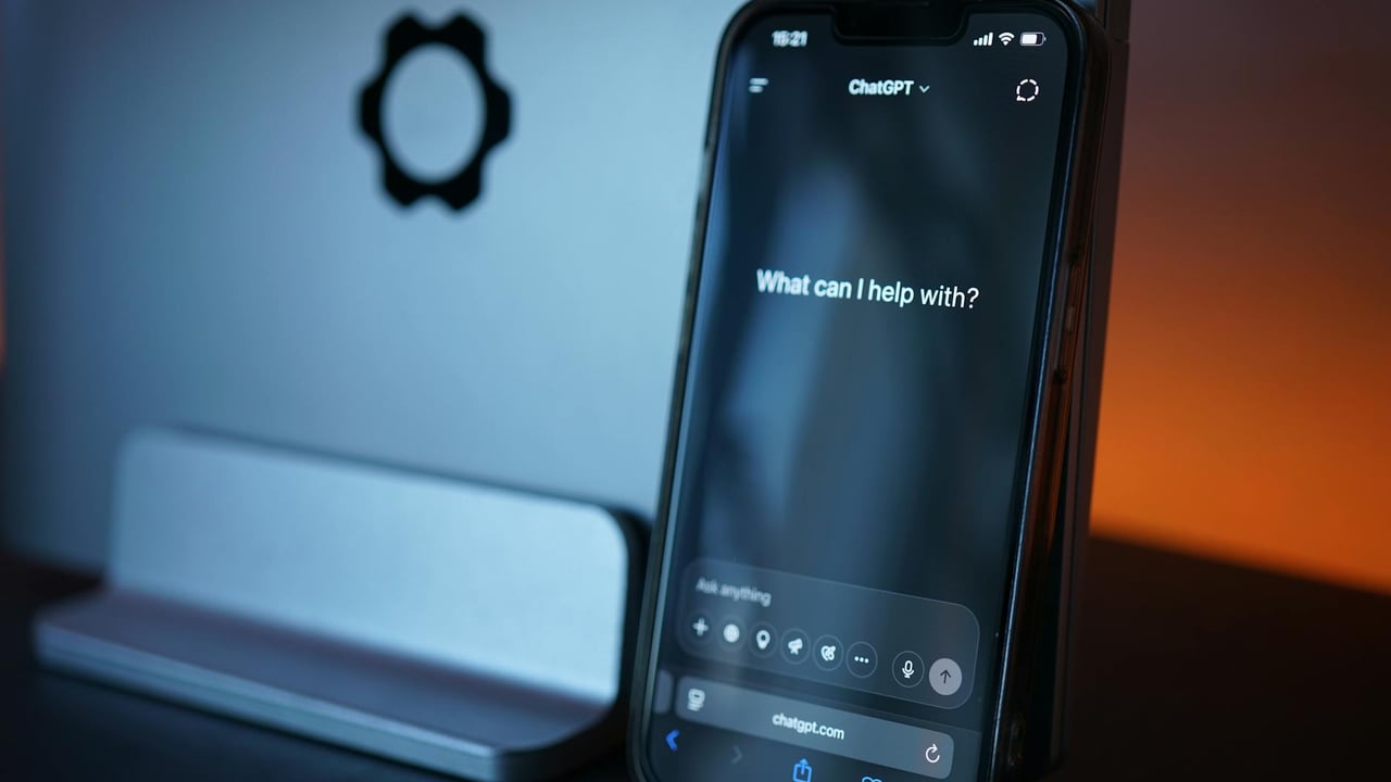 Close-up of a smartphone with AI chat interface, showcasing advanced technology in a sleek design.