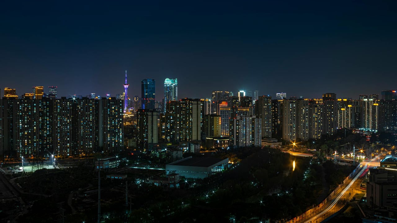 Explore the vibrant Chengdu skyline at night showcasing urban architecture and city lights.