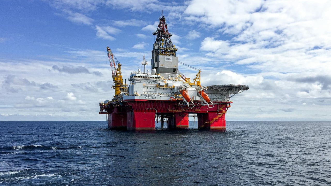 Majestic offshore oil platform under a bright sky in the North Sea, showcasing Norway's energy infrastructure.