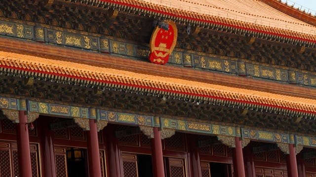 Close-up view of ornate architectural details in Beijing's Forbidden City, showcasing traditional Chinese design elements.