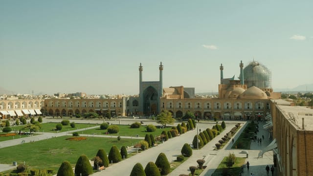 Aerial view of Naqsh-e Jahan Square in Isfahan, showcasing Persian architecture and gardens.