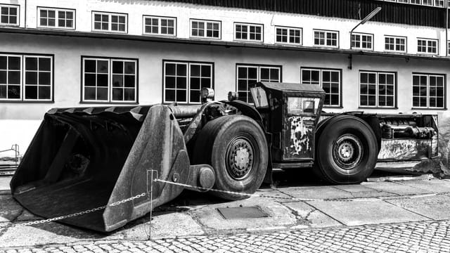 Black and white photo of historical mining machinery at Rammelsberg Museum in Goslar, Germany.