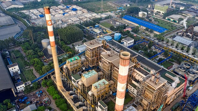 Bird's-eye view of a sprawling industrial plant in Serang, showcasing smokestacks and facilities.