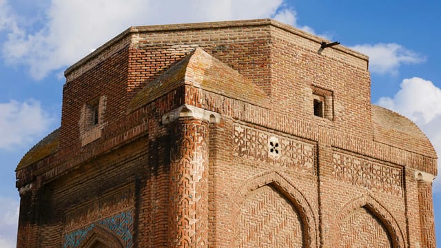 Red brick architecture of Gonbad-e Sorkh, a historical mausoleum in Maragheh, Iran.