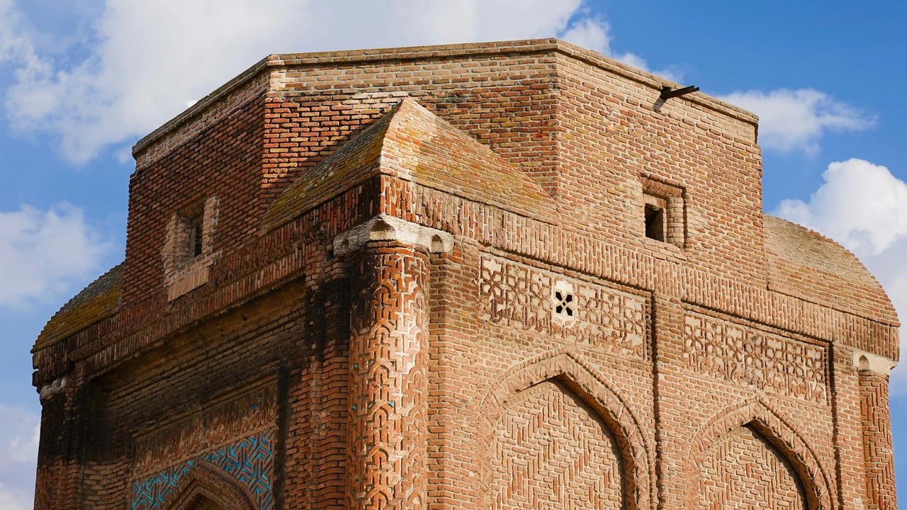 Red brick architecture of Gonbad-e Sorkh, a historical mausoleum in Maragheh, Iran.