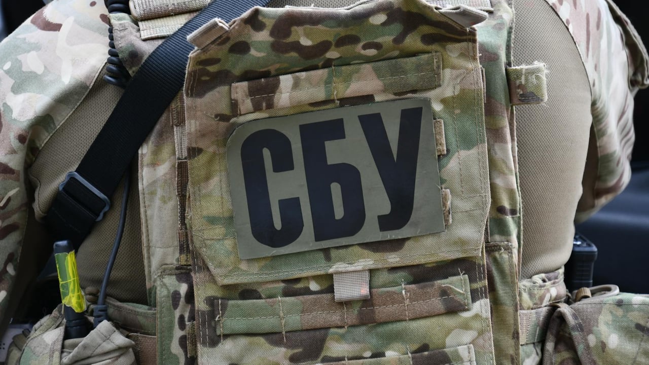 Close-up of a soldier wearing a camouflage vest with the Security Service of Ukraine insignia in Kyiv.