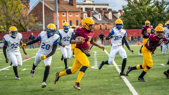 Action-packed American football match capturing teamwork in Baltimore, MD.