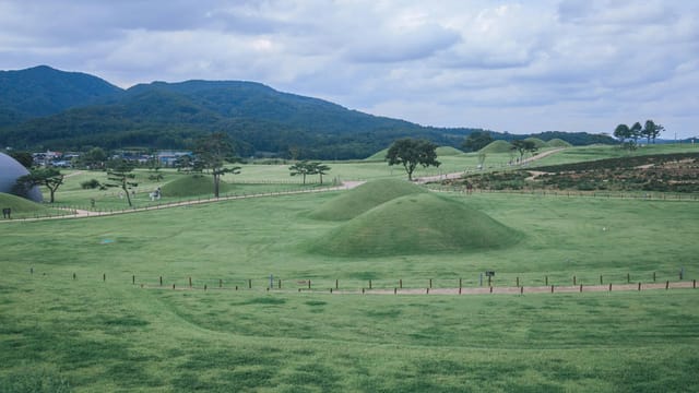 Beautiful hills and grasslands under an overcast sky in Yeongcheon, South Korea.