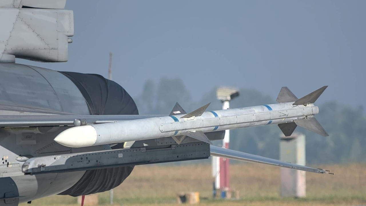 Close-up of a missile mounted on a military aircraft wing at an airshow in Bengaluru, India.