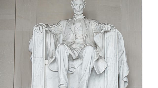 Iconic statue of Abraham Lincoln inside the Lincoln Memorial in Washington DC.