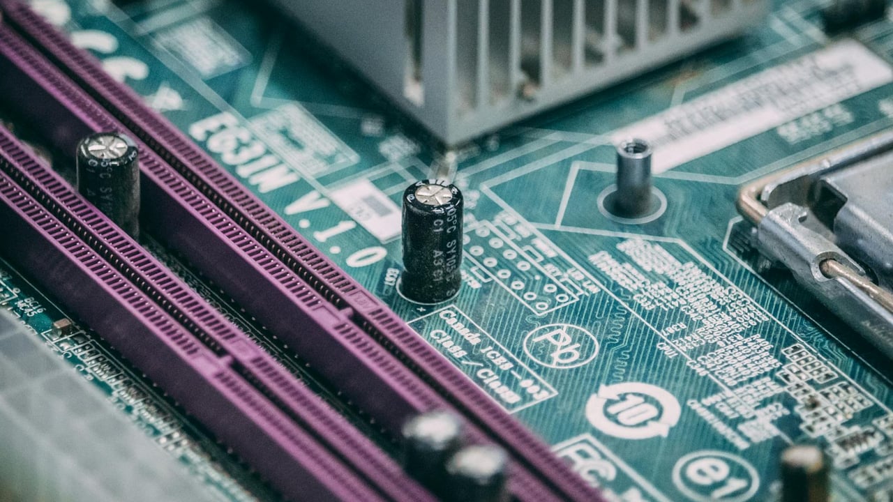 Detailed close-up image of a computer circuit board with capacitors and other components.