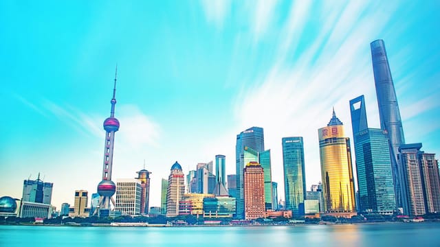 Stunning view of Shanghai's skyline with iconic skyscrapers and vibrant sky.