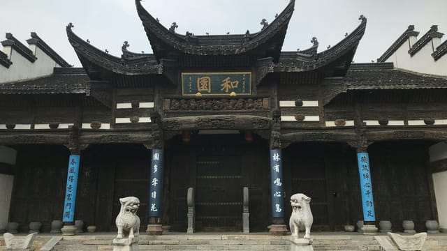 Ornate entrance of a historic Chinese temple in Nanjing, showcasing intricate architecture and sculptures.