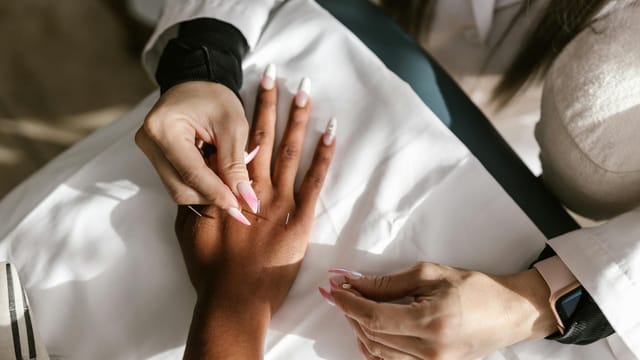Close-up of hands during an acupuncture therapy session for holistic health and wellness.
