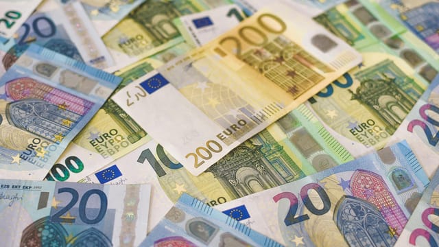 Colorful assortment of Euro banknotes in various denominations, signifying wealth and finance.