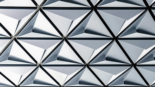 Futuristic silver geometric pattern on a modern building in Toronto.
