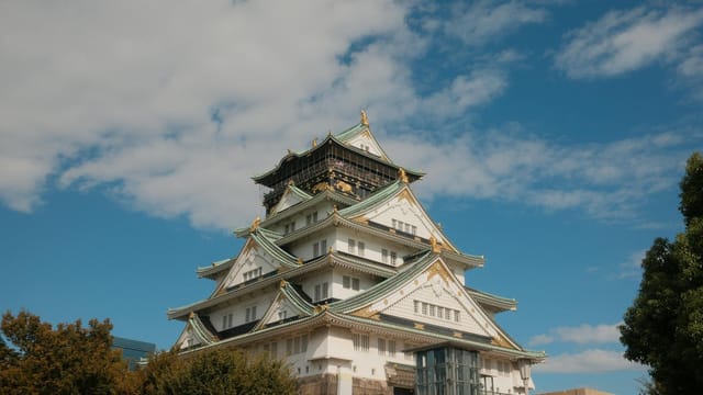 Majestic Osaka Castle captured against a clear blue sky in Japan.