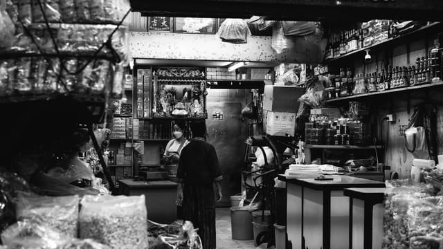 Explore the bustling atmosphere of a local grocery store in Bangkok, Thailand.