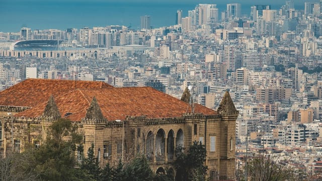 Aerial view of Beirut's cityscape featuring historic architecture and urban skyline.