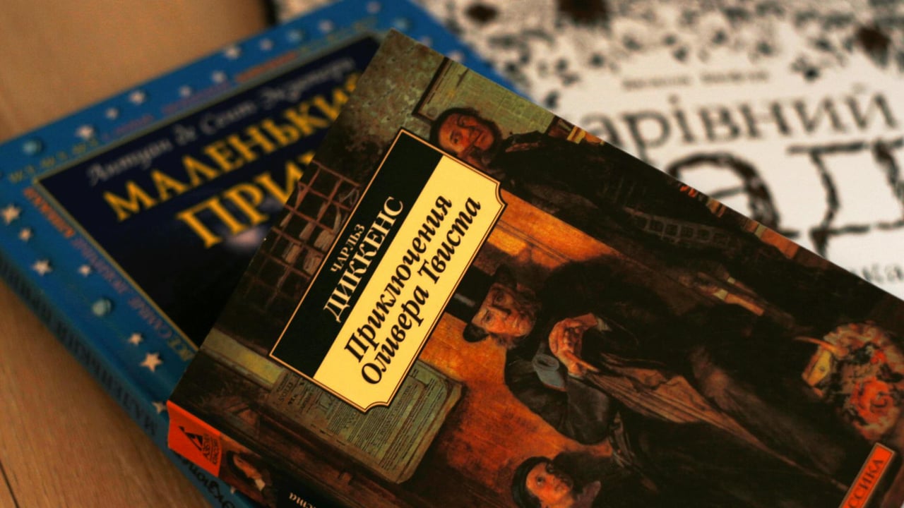 Close-up of Ukrainian versions of classic literature, including 'Oliver Twist' by Charles Dickens.