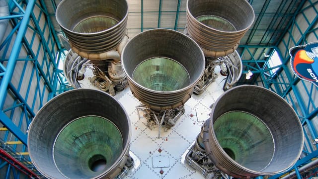 Detailed view of Saturn V rocket engines at Kennedy Space Center, showcasing engineering marvel.