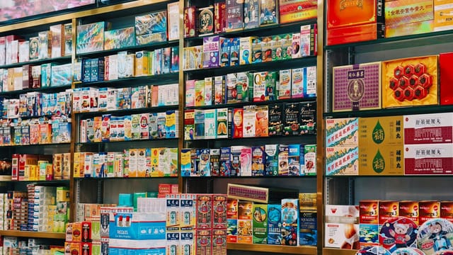 Bright and colorful display of various Asian products on supermarket shelves.