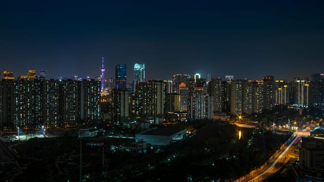 Explore the vibrant Chengdu skyline at night showcasing urban architecture and city lights.
