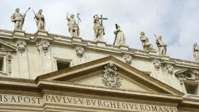 Statues adorning the facade of St. Peter's Basilica in Vatican City, a UNESCO World Heritage Site.