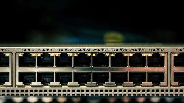 Detailed view of a network switch featuring multiple ethernet ports and LED indicators.