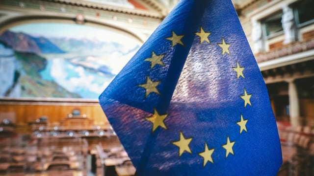 Close-up of the European Union flag inside the Swiss Parliament's National Council chamber in Bern.