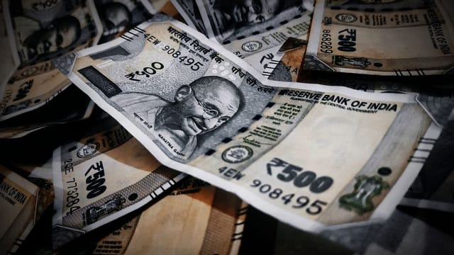 Close-up of Indian rupee notes illustrating abundance and financial concepts.