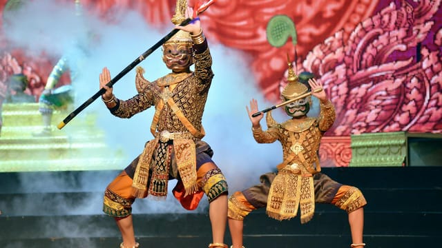 Vibrant Khmer dance performance with dancers in traditional costumes in Phnom Penh, showcasing cultural heritage.