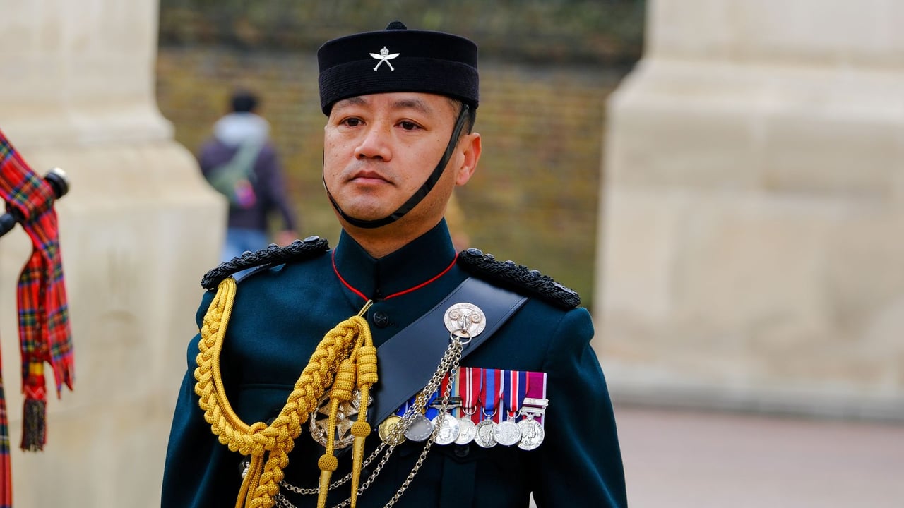 A Gurkha soldier in formal attire with medals, England, UK.