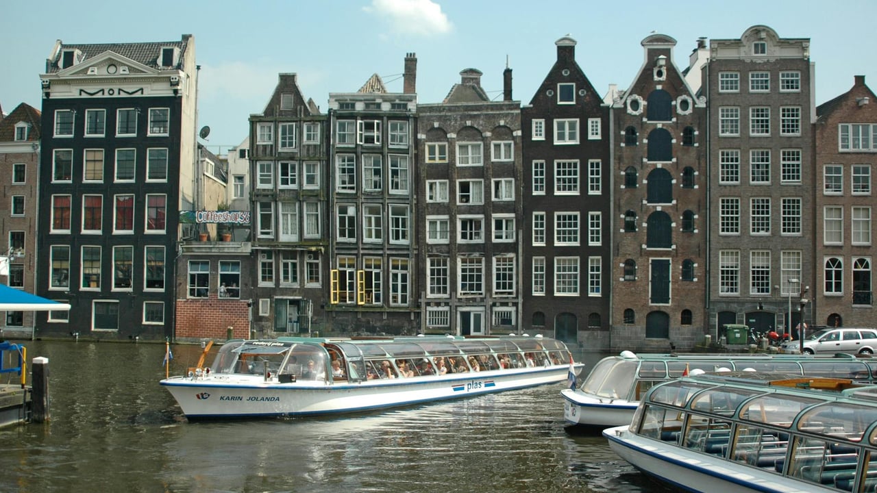 Explore Amsterdam's canals with historic gabled houses and iconic watercrafts.