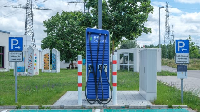 Illustrative image: Public charging station with eco-friendly design for electric vehicles.