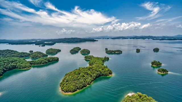Explore the stunning islands of Qiandao Lake, a serene landscape in Zhejiang, China.