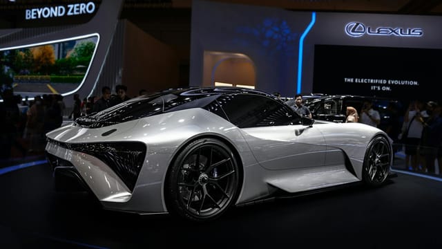 Modern electric sports car displayed at international auto show. Sleek design and futuristic features.