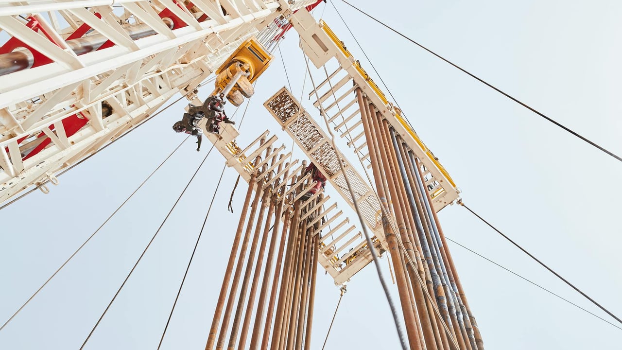 Dynamic low angle view of an oil rig structure in Al Wafrah, Kuwait.