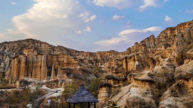Explore the dramatic sandstone cliffs and geological formations of the Chuxiong Yi Autonomous Prefecture.