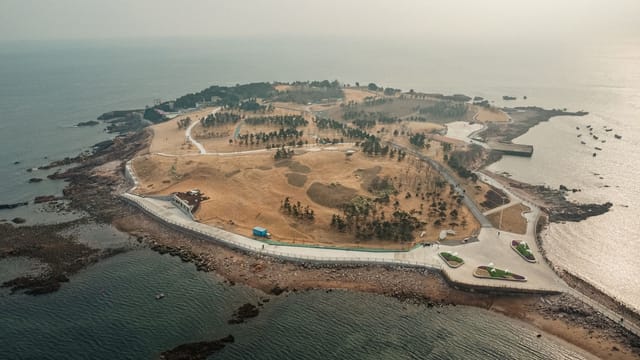 Stunning aerial shot of Qingdao island, showcasing its scenic seaside landscape.