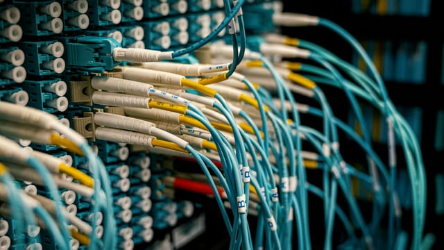 Fiber optical device with similar bright connectors with blue cables made of rubber with plastic pigtails on edges