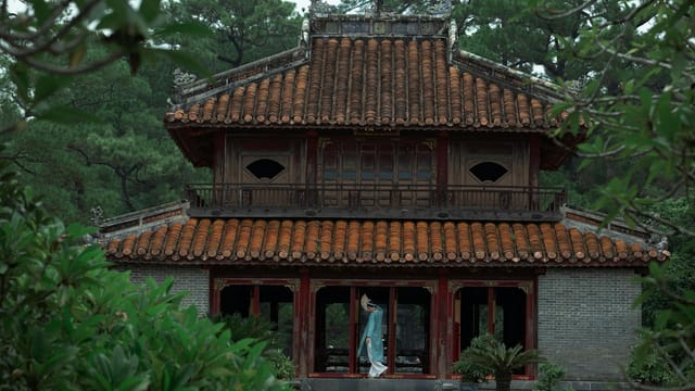 Stunning view of a traditional Vietnamese building surrounded by greenery, reflecting cultural heritage.