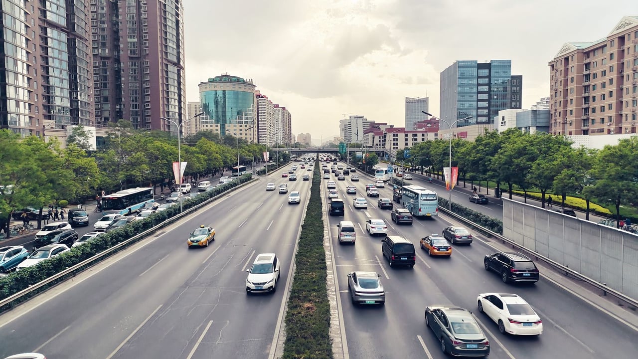 High angle view of a busy expressway in Chaoyang District, Beijing, showcasing urban traffic and cityscape.