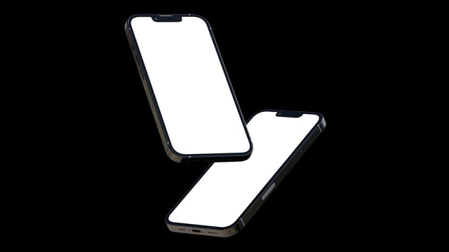 Two sleek smartphones with blank screens floating against a white background, perfect for design mockups.
