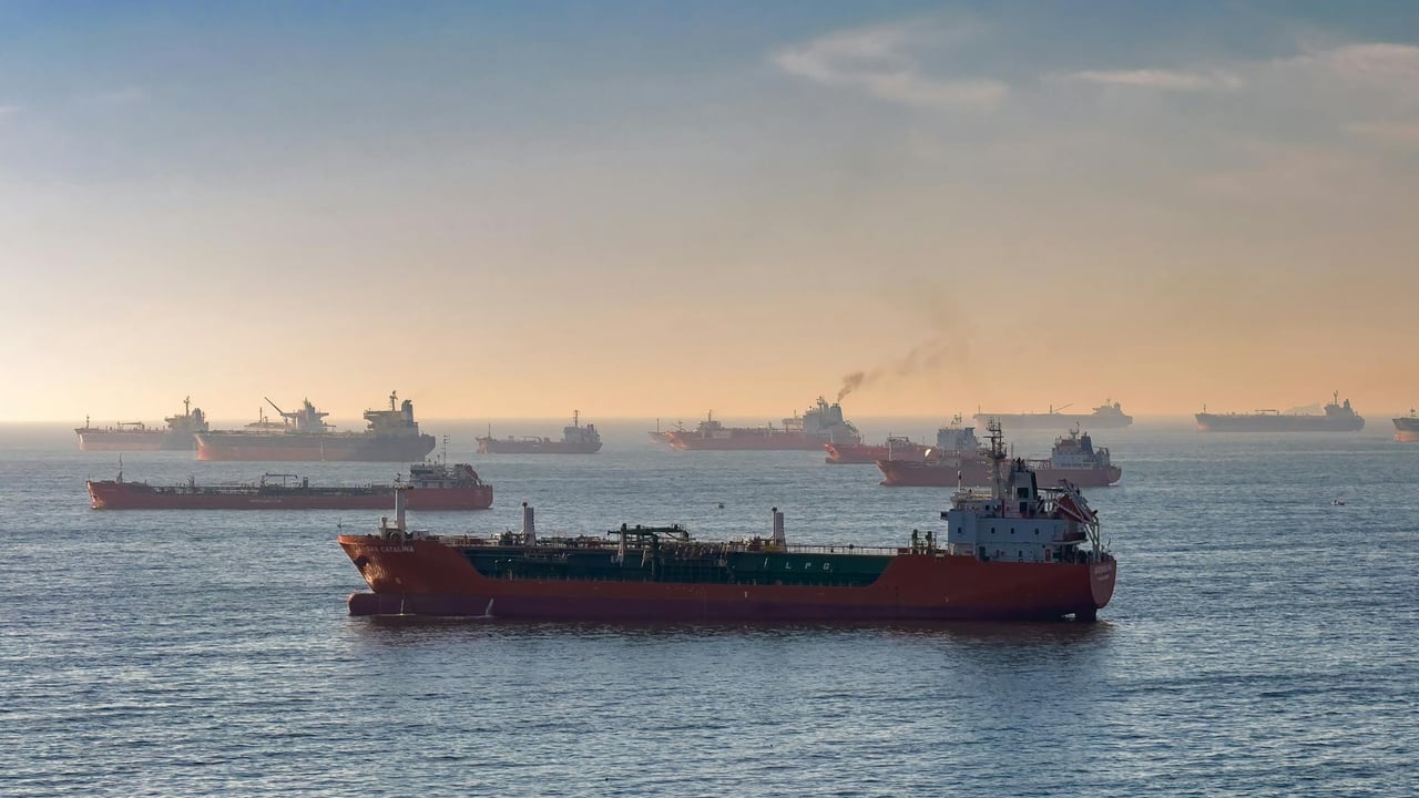 Cargo ships and oil tankers on the Bosporus strait, capturing global trade and maritime logistics at sunset.