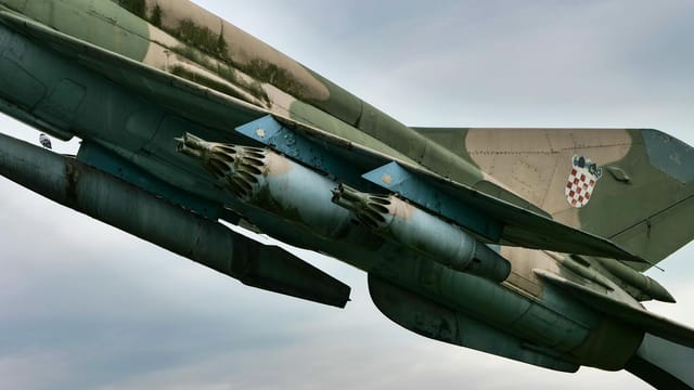 Close-up of a military jet fighter featuring a Croatian emblem, showcasing aviation detail.