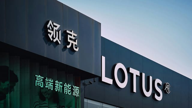 Lotus dealership exterior in urban Tianjin, China with bold signage.